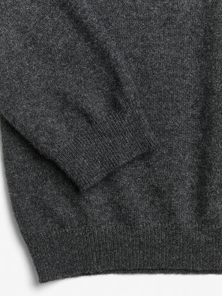 Dark grey fitted V-neck cashmere sweater with a 90s-inspired silhouette, clean neckline, and flattering slim fit in 100% Grade A cashmere