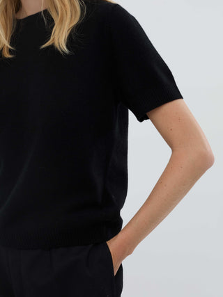 Black women's blouse knitted in 12-gauge 100% Grade A Inner Mongolian cashmere, featuring a cropped, boxy silhouette and short sleeves