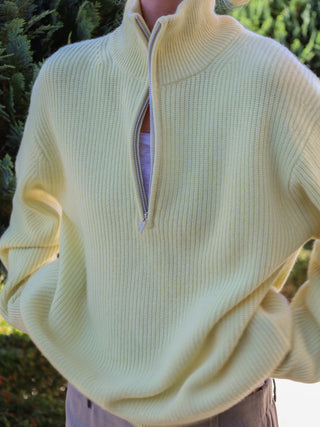Soft yellow ribbed zip turtleneck jumper in 100% Grade A Inner Mongolian cashmere, featuring a high neck, half-zip design, and relaxed fit
