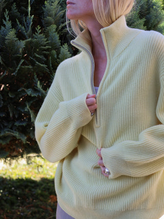 Soft yellow ribbed zip turtleneck jumper in 100% Grade A Inner Mongolian cashmere, featuring a high neck, half-zip design, and relaxed fit