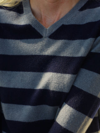 Navy blue and solid grey striped fitted V-neck cashmere sweater with wide stripes, clean neckline, and a flattering 90s-inspired silhouette in 100% Grade A cashmere