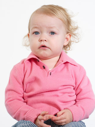 Kids’ pink polo shirt with long sleeves and classic collar