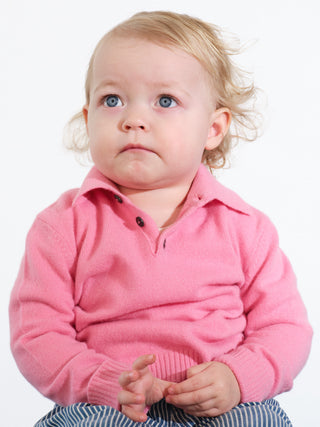 Kids’ pink polo shirt with long sleeves and classic collar