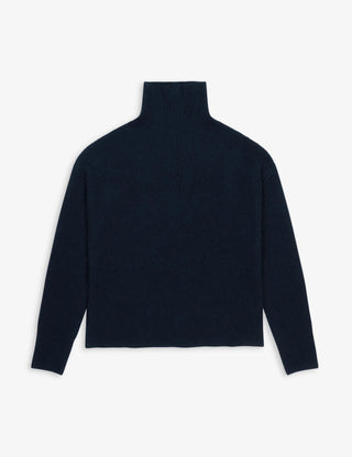 Navy blue premium ribbed turtleneck knitted in 7-gauge 100% Grade A Inner Mongolian cashmere, with a chunky texture, high neck, and relaxed oversized fit