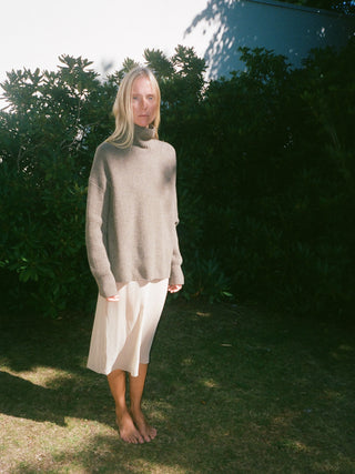 Truffle ribbed turtleneck jumper with a relaxed, slightly oversized fit, crafted from 100% Grade A Inner Mongolian cashmere