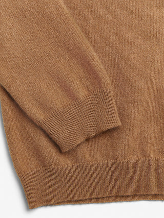 Caramel fitted V-neck cashmere sweater with a 90s-inspired silhouette, clean neckline, and flattering slim fit in 100% Grade A cashmere