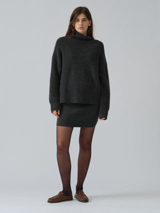 Dark grey women's mini skirt crafted from 100% Grade A Inner Mongolian cashmere in a fine 12-gauge knit, designed for a flattering fit and lasting shape