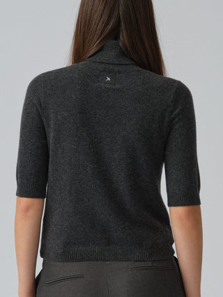Dark grey women's turtleneck blouse in 100% Grade A Inner Mongolian cashmere, 12-gauge knit, featuring a ribbed turtle neckline, three-quarter sleeves, and a cropped fit