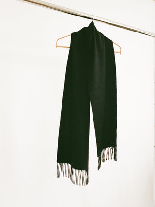 Black cashmere woven scarf with a smooth, slightly shiny finish and fringed ends