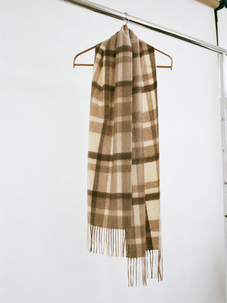 Checked Sand cashmere woven scarf with a smooth, slightly shiny finish, soft lightweight feel, and fringed ends