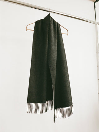 Dark Grey cashmere woven scarf with a smooth, slightly shiny finish and fringed ends